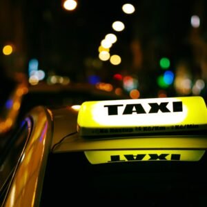 a taxi cab with a taxi light on top of it